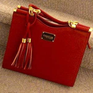 This amazing Bebe purse is brand new and very stylish. NWOT